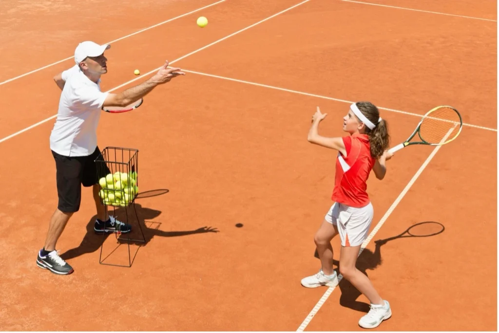 How many shots should junior tennis players hit per week?